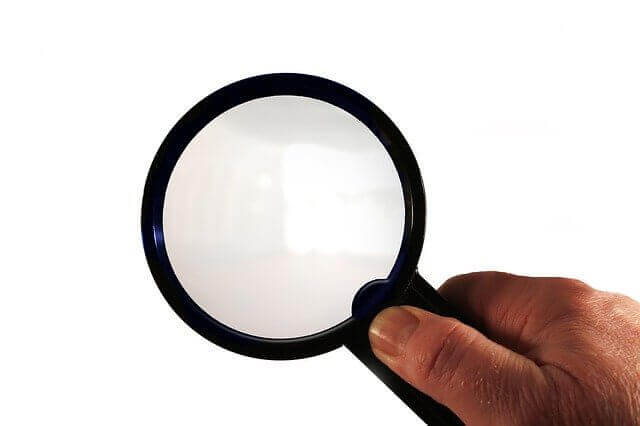 A magnifying glass to represent a trademark search