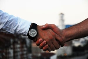 Two business people shaking hands