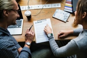 Meeting between two people signing a contract