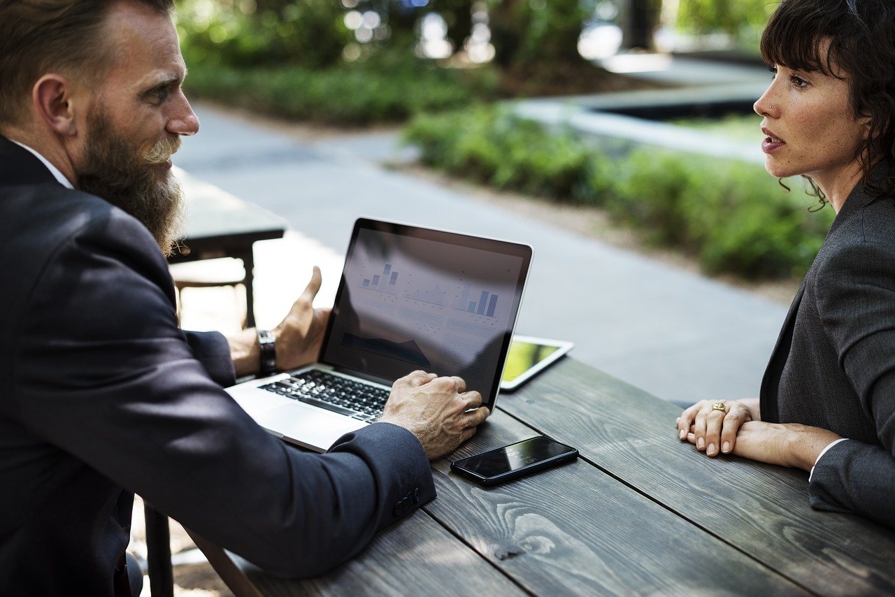 Two people discussing business potential in Peru