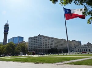 Chilean flag outside building: the government has made it easier for foreigners to do business in Chile with a double taxation agreement