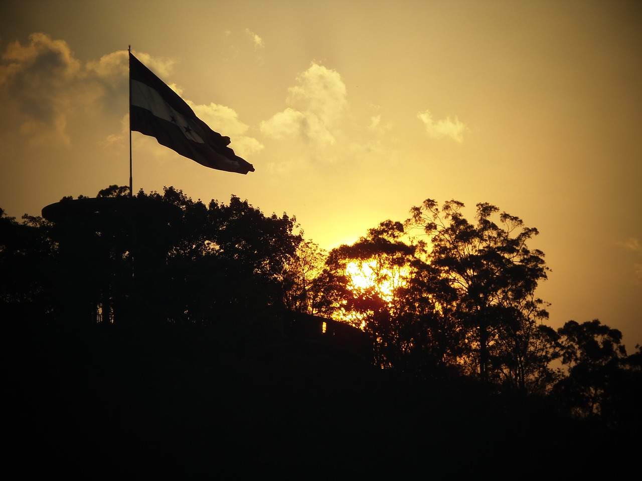 Honduras flag at sunset