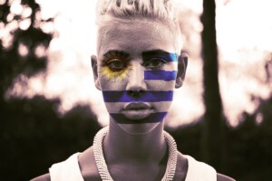 Woman with Uruguay flag painted on her face