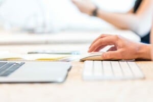 Person using a keyboard to conduct a trademark search in Central America 