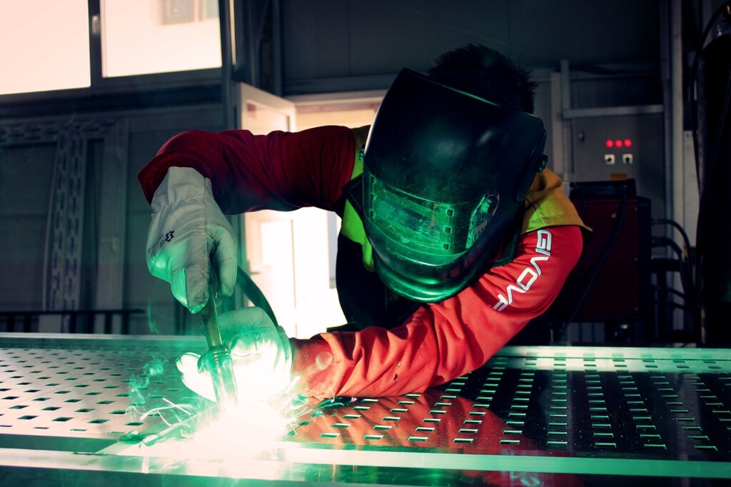 Person welding for an Australian manufacturing company