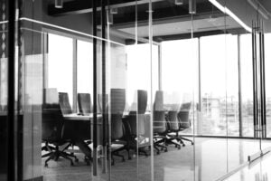 Black and white image of empty boardroom.