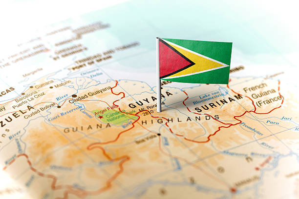 A photo of a flag pin in a map showing Guyana, which is emerging as an important oil producer