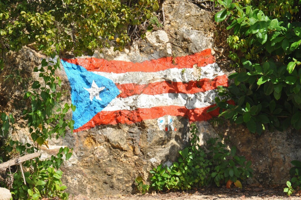 A photo of the flag of Puerto Rico painted onto a rock. Puerto Rico tourism recently broke a new record