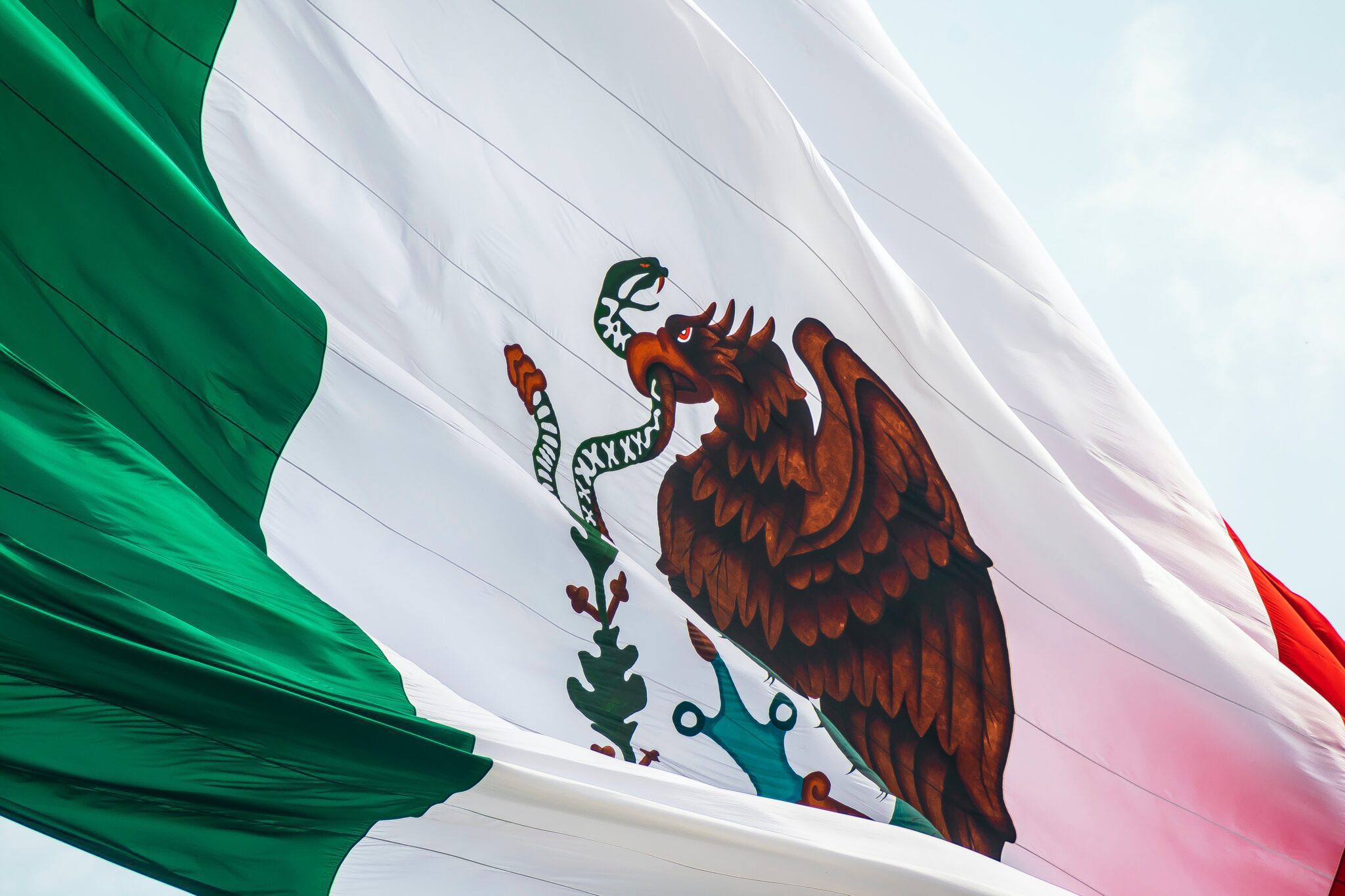 Stock image of Mexican flag to accompany article on financial regulatory compliance in Mexico